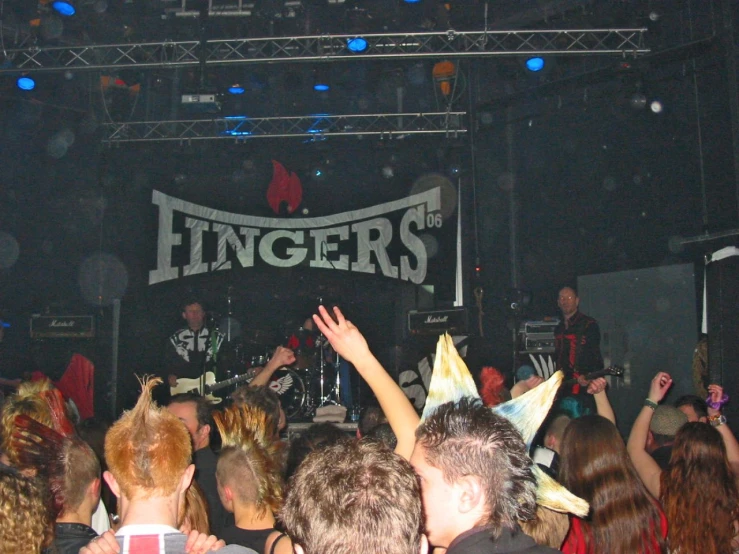an image of band on stage at a concert
