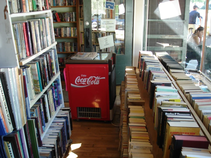 a bookshop with many books, machines and windows