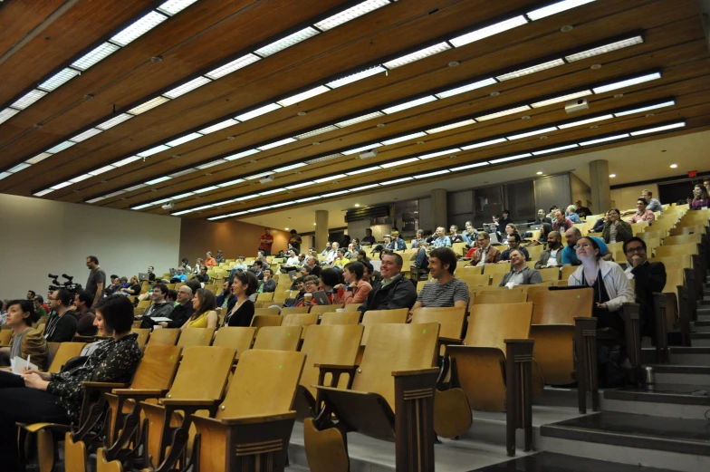 a large group of people are standing inside a room