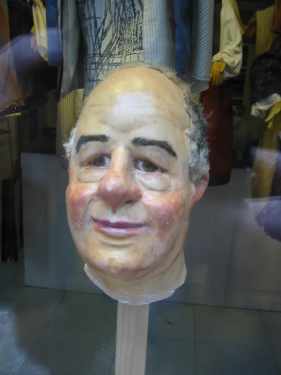 a face on a dummy in a clothing store