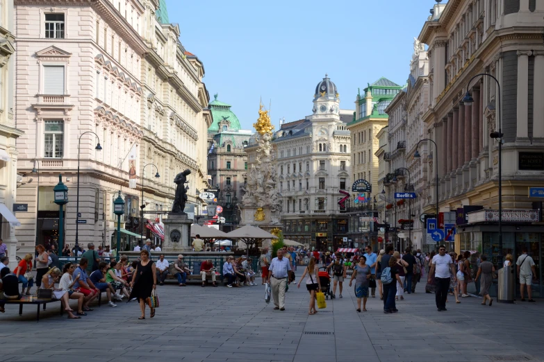 a group of people walking around an urban area