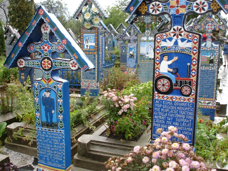 a group of colorful houses sitting on top of plants