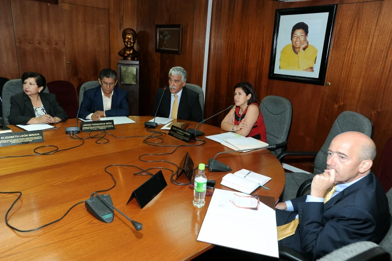 people sitting around the conference table