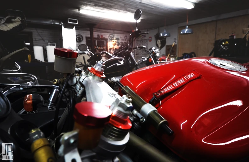 there are many motor bikes parked in this garage