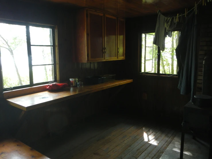 kitchen with wooden counters in small home with sunlight coming through windows