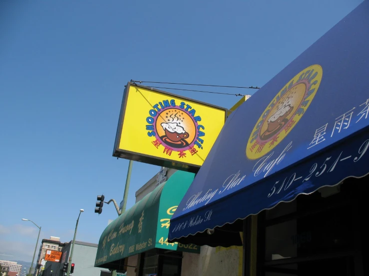 a yellow and blue burger restaurant sign that says super chicken