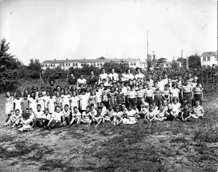 an old po of people posing for a team picture