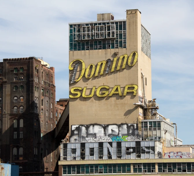 an old fashioned building sitting on the side of a river