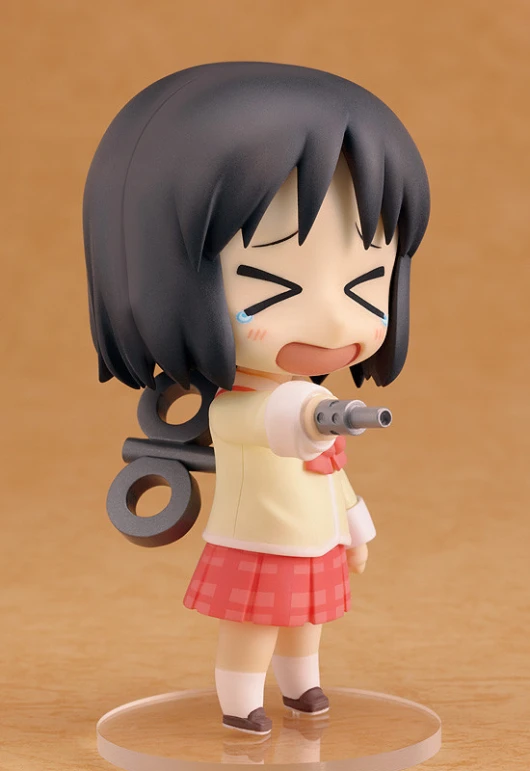 a figure of a girl holding a gun, with an expression on her face