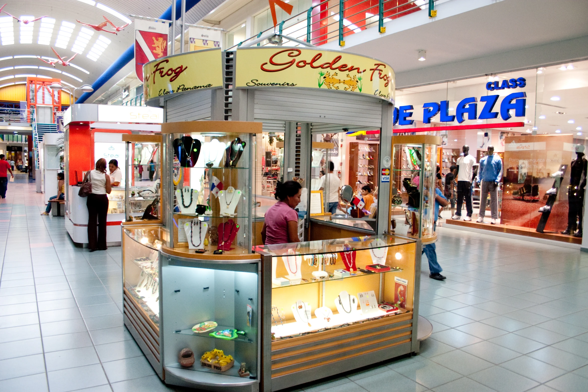 a retail center with some shoppers and a shop