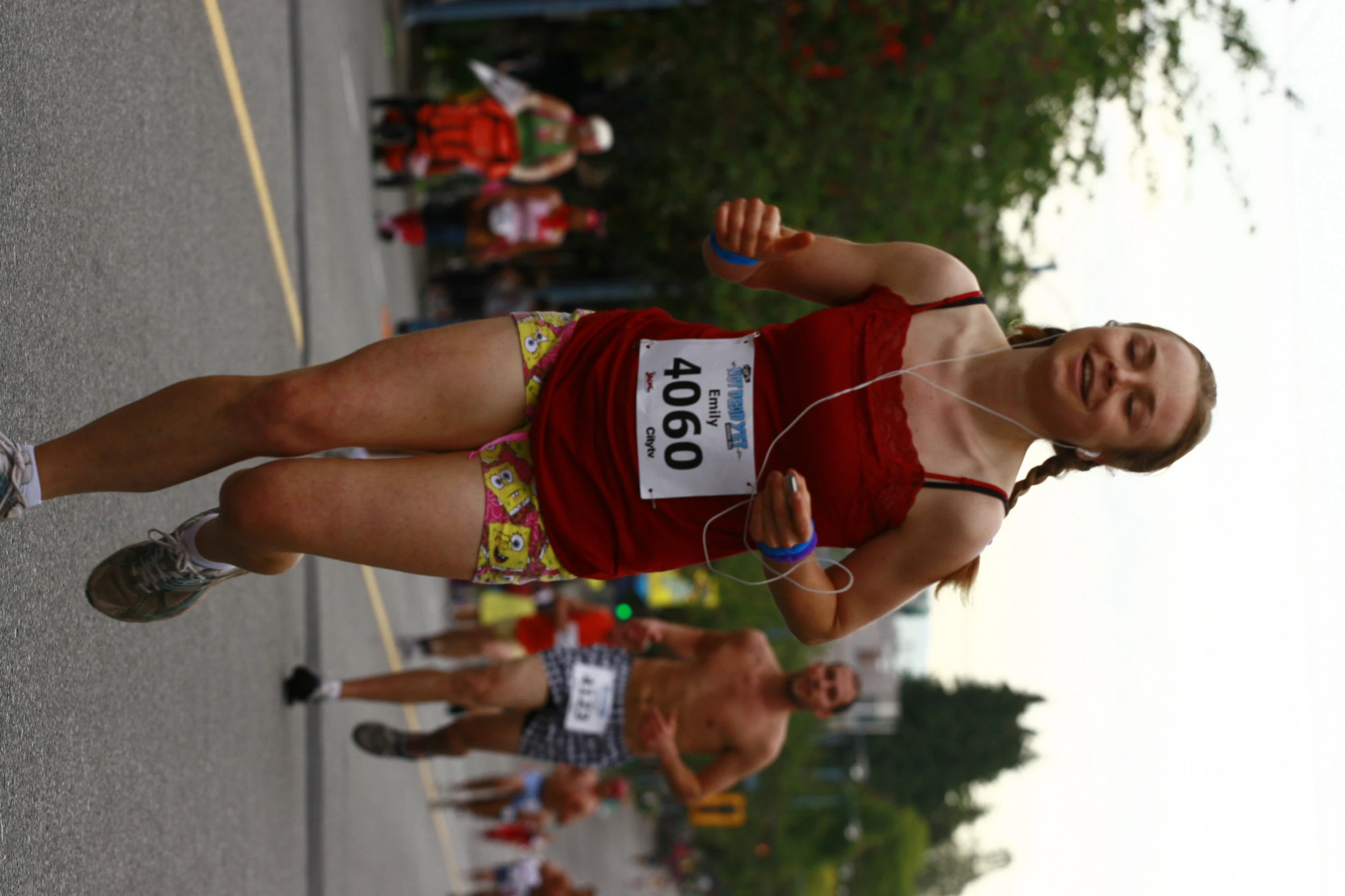 a woman in underwear running down a road