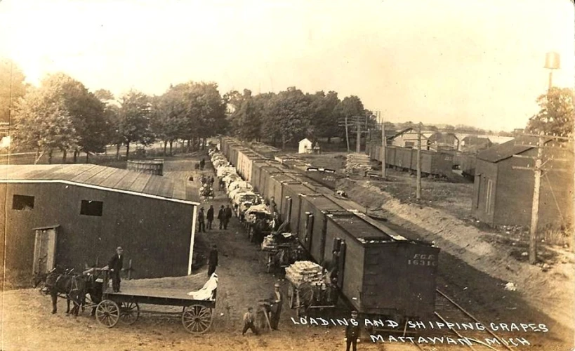 a large train yard with people on the tracks