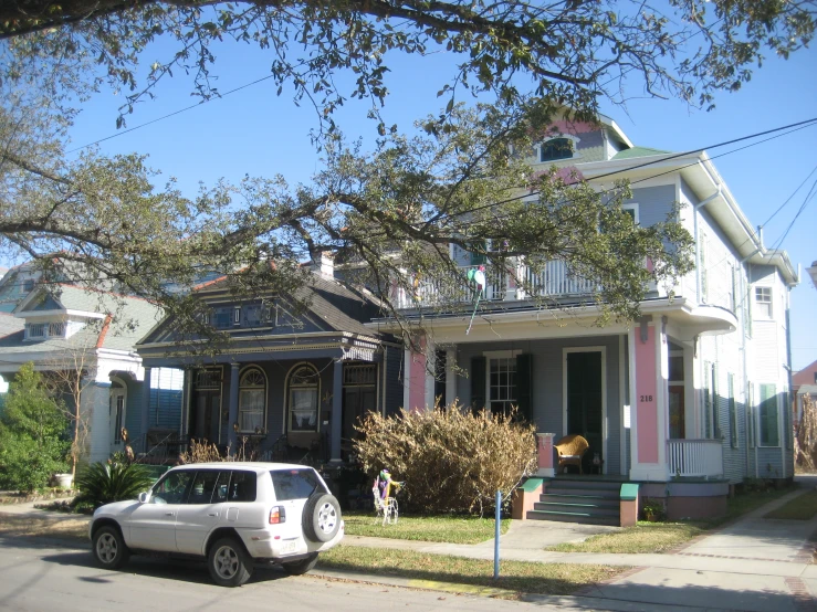 a car is parked in front of the building on the street