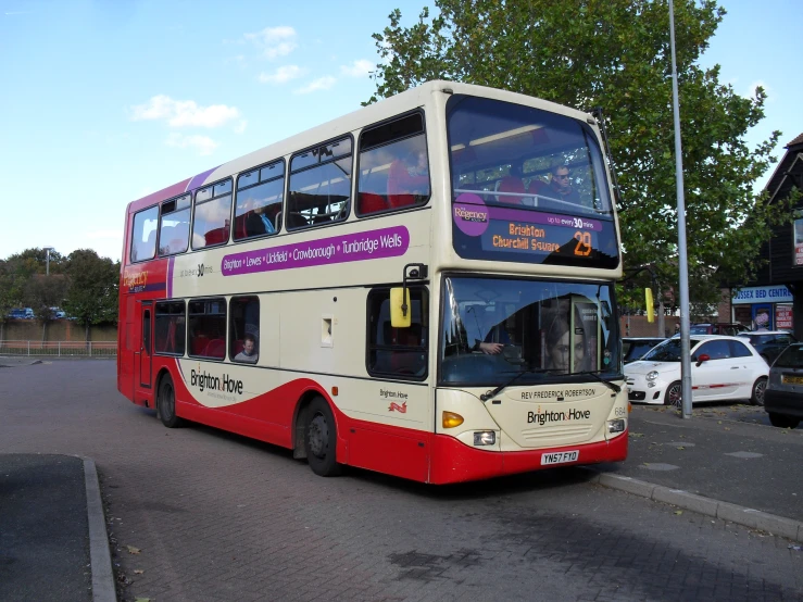 a double decker bus that is driving down the street