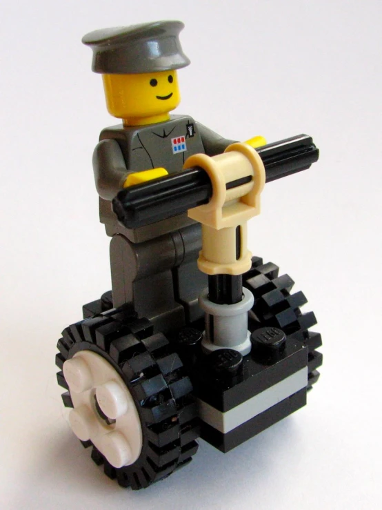 a lego police officer with an automatic gun