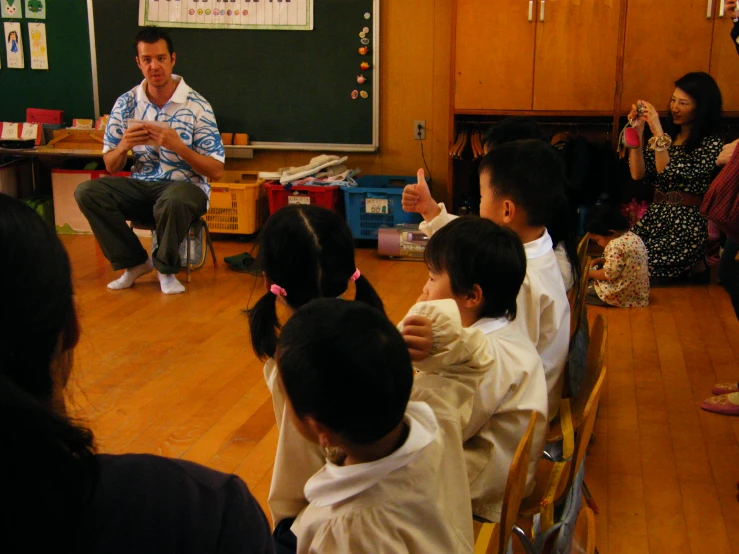 an instructor teaching children how to read