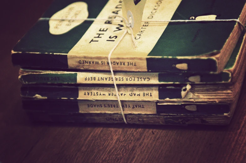 a stack of books sitting on top of a table