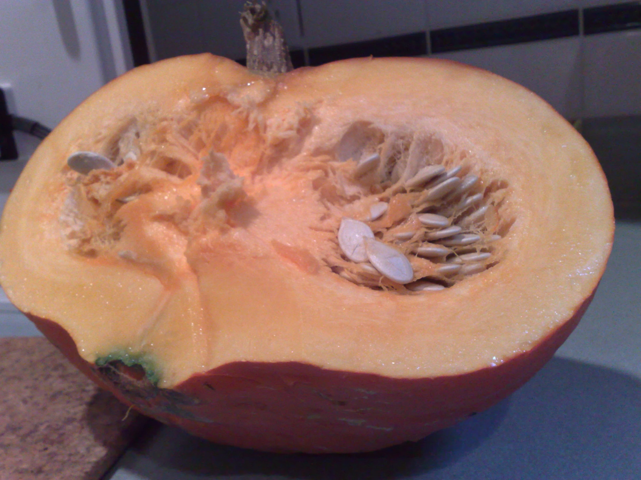 the fruit is cut in half to show the seeds