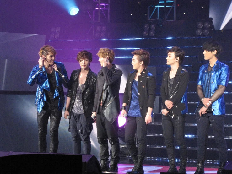 many male concert members on stage