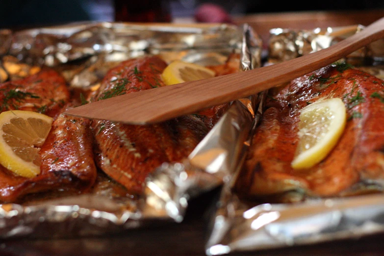 a plate full of roasted chicken with lemon and parsley