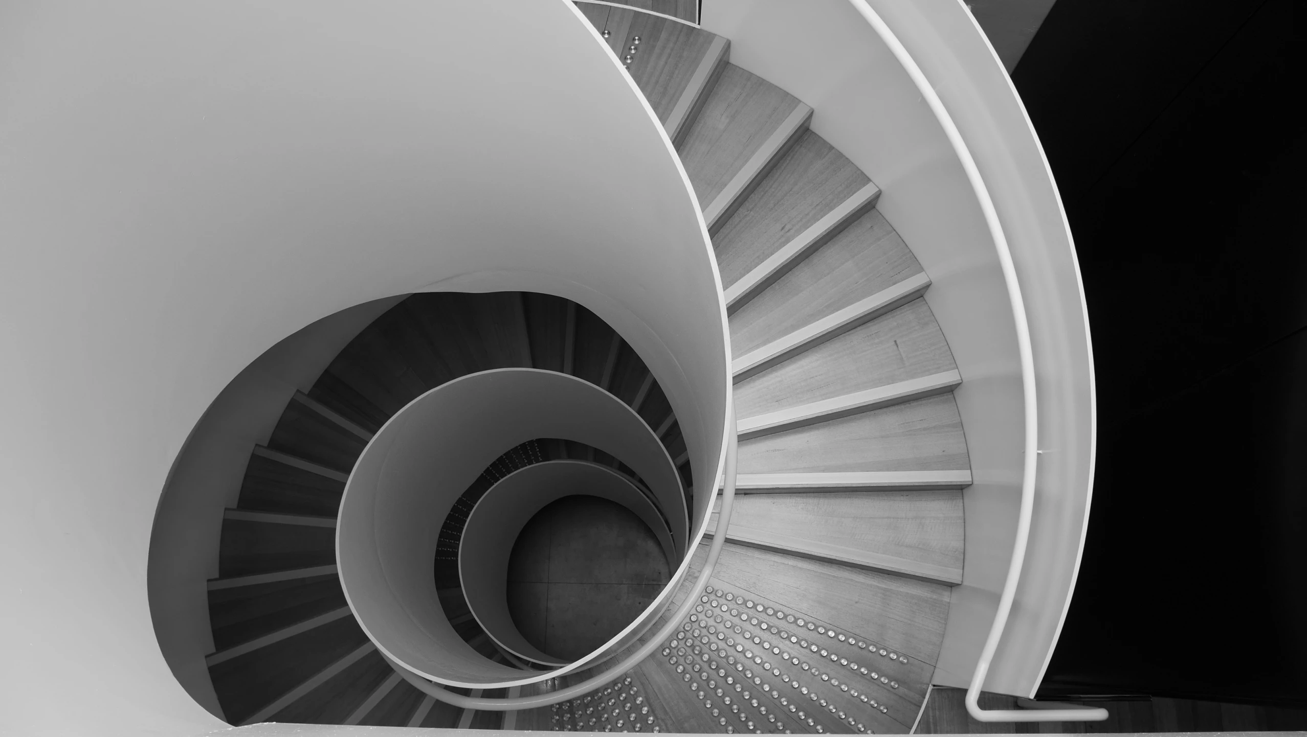 a view of a spiral stair going up into the sky