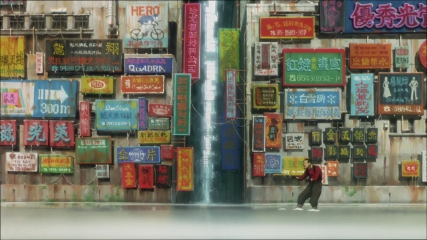 this is an image of someone walking in front of a wall of signs