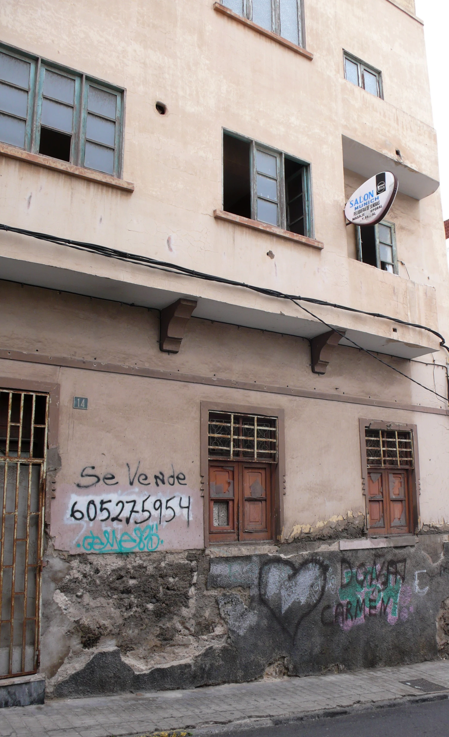 the facade of a building has graffiti written on it