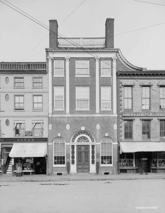 a black and white po of two brick buildings