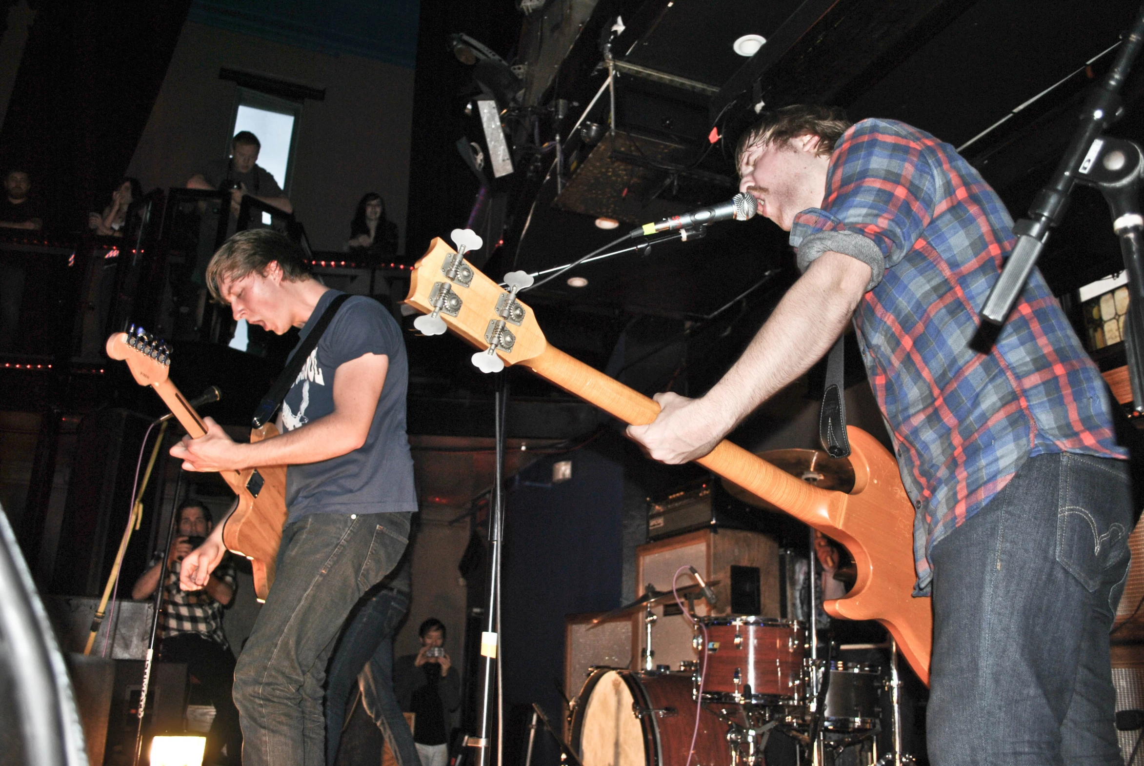 two guys that are playing some guitars together