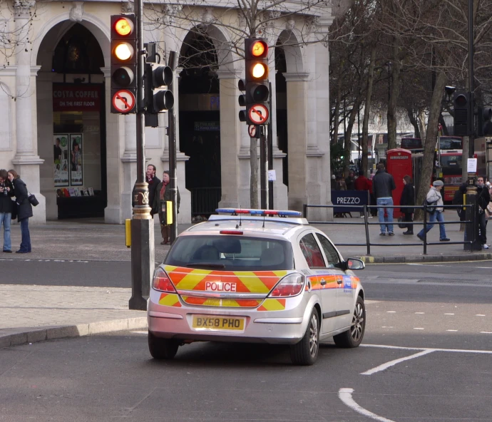 an ambulance that is on a street corner