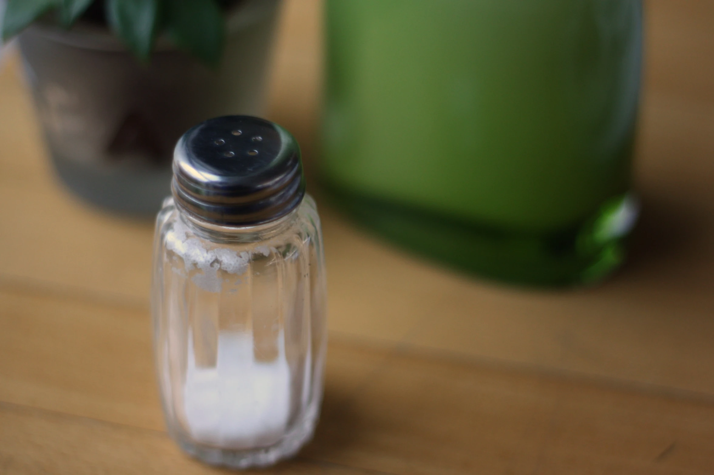 salt in a jar with a pot in the background