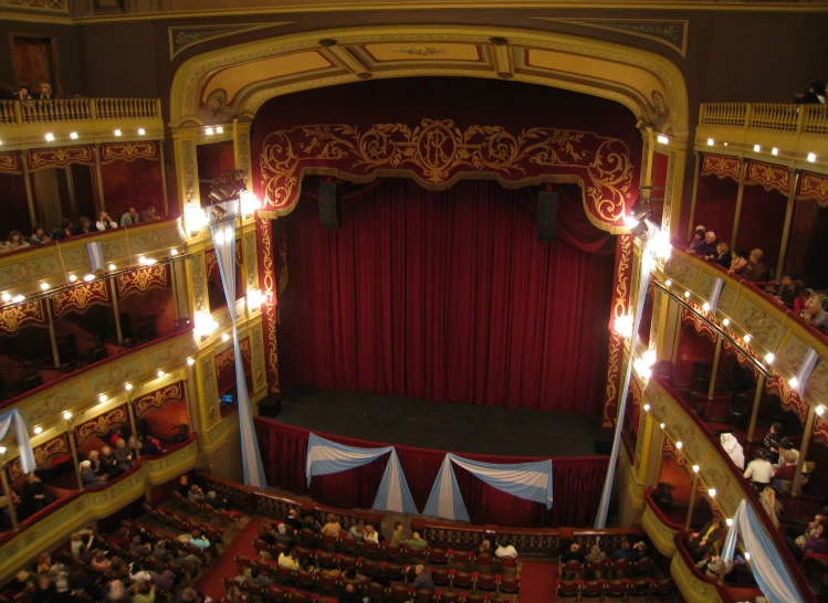 an overview view of a theatre with some people watching