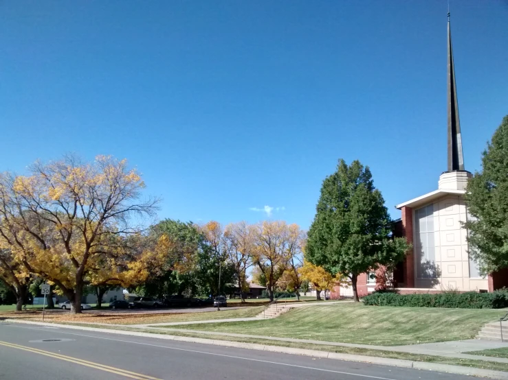 a church building with a flag in the background