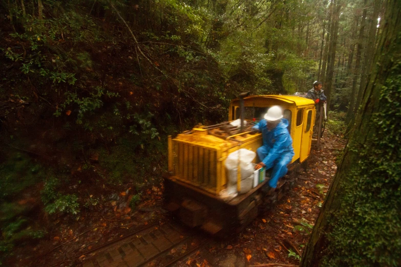 a person in a blue suit on a yellow truck