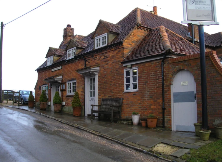 two very cute brick buildings in the middle of town