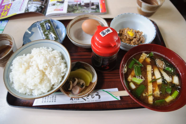 an asian meal of rice, meat and vegetables