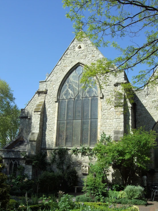 an old church sitting in the middle of a park