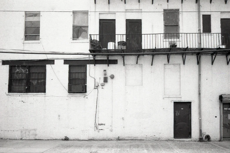 two people sitting on the balcony of a building