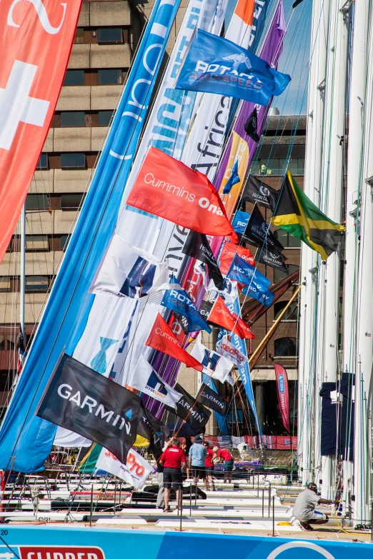 a crowd of people in front of a large display