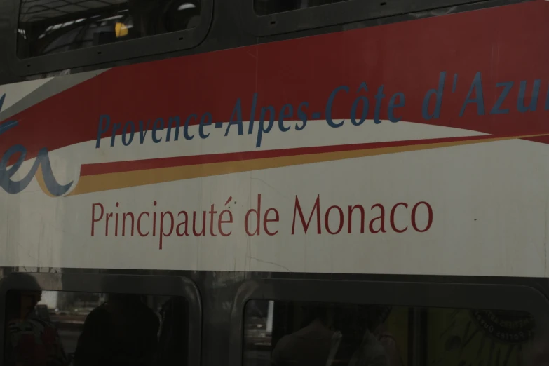 a double decker bus with french writing on the side