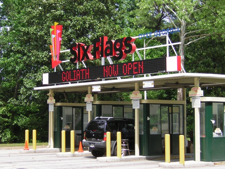 the car is parked next to the station