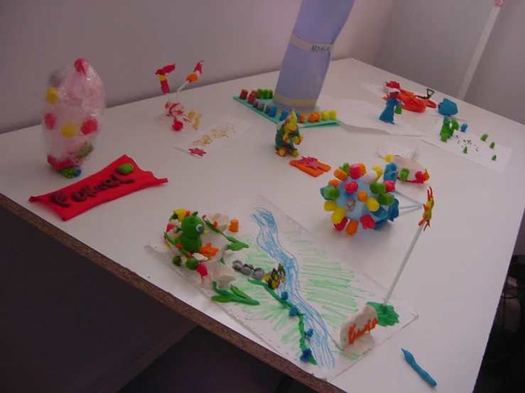 a white table topped with lots of colorful toys