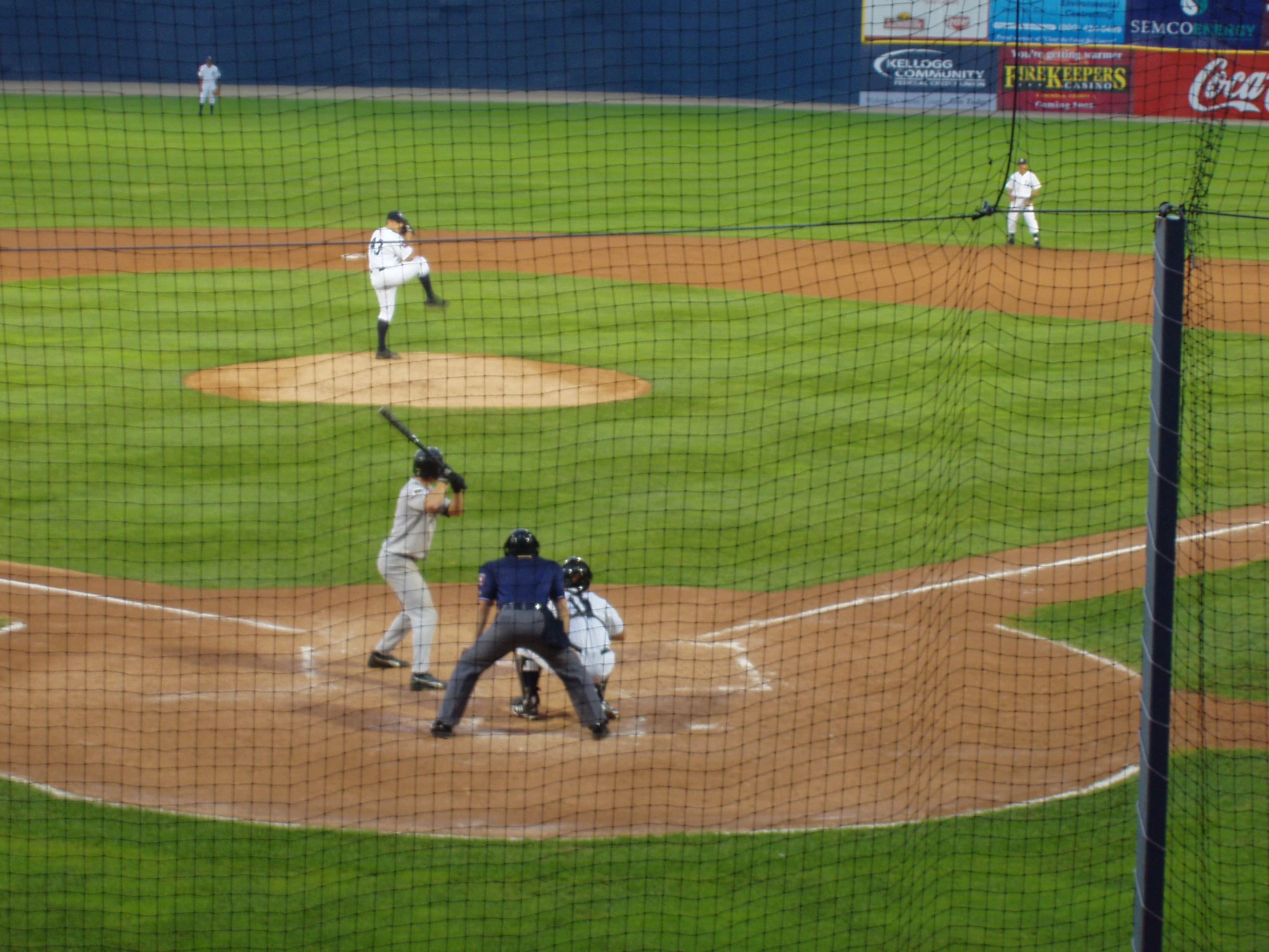 a baseball player is about to hit a ball