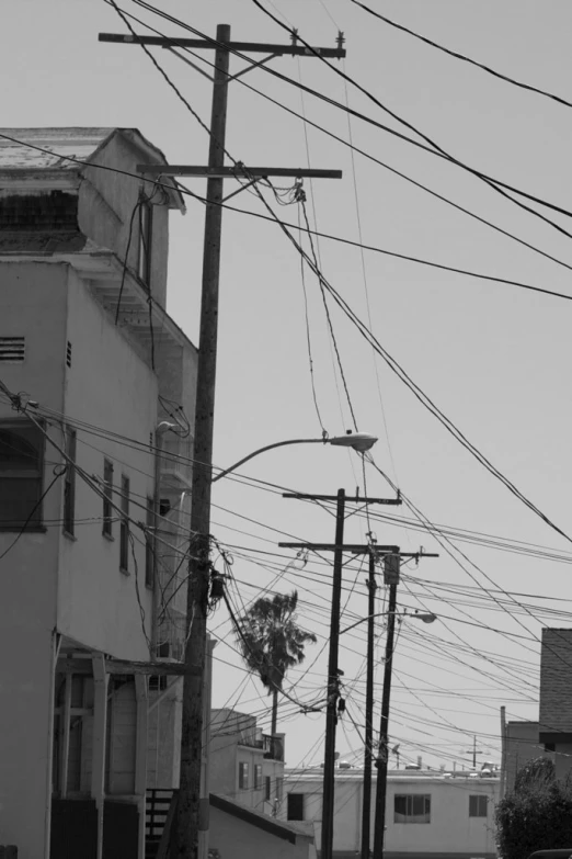 the intersection with lots of wires and buildings on one side