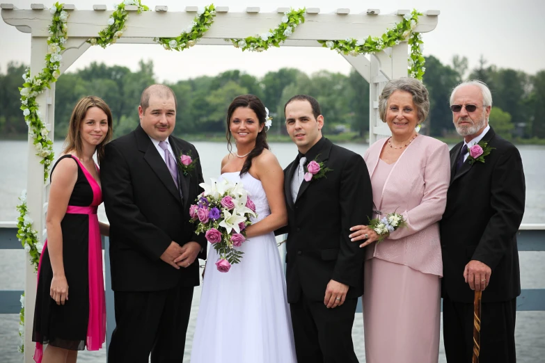 a bride and groom with their three daughters