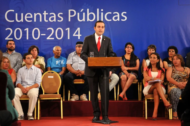 a man speaking at the convention at an event