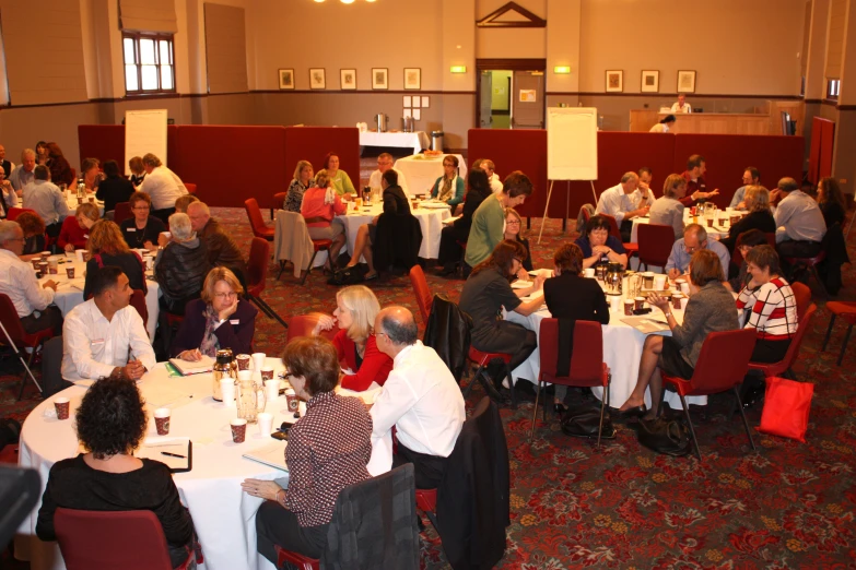 large room filled with people having an important meeting