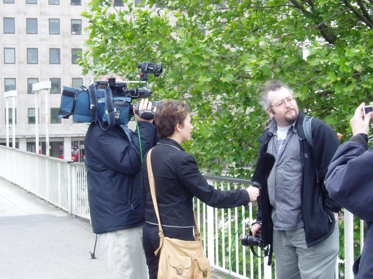 a man that is holding a camera up