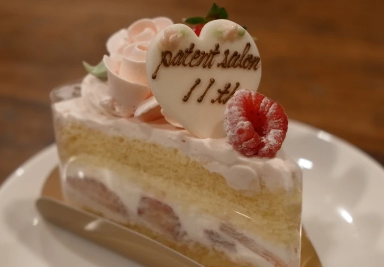 a piece of strawberry cream cake on a plate