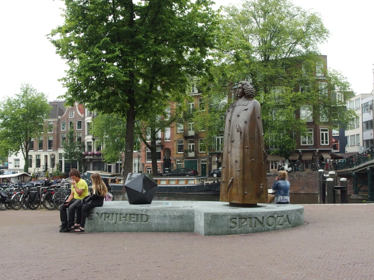 the two people sit on the concrete bench